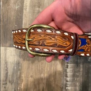 Tony lama belt size small and engraved leather with blue accents